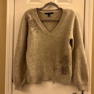 Grey White House Black Market Dressy V Neck Sweater with beading detail.
